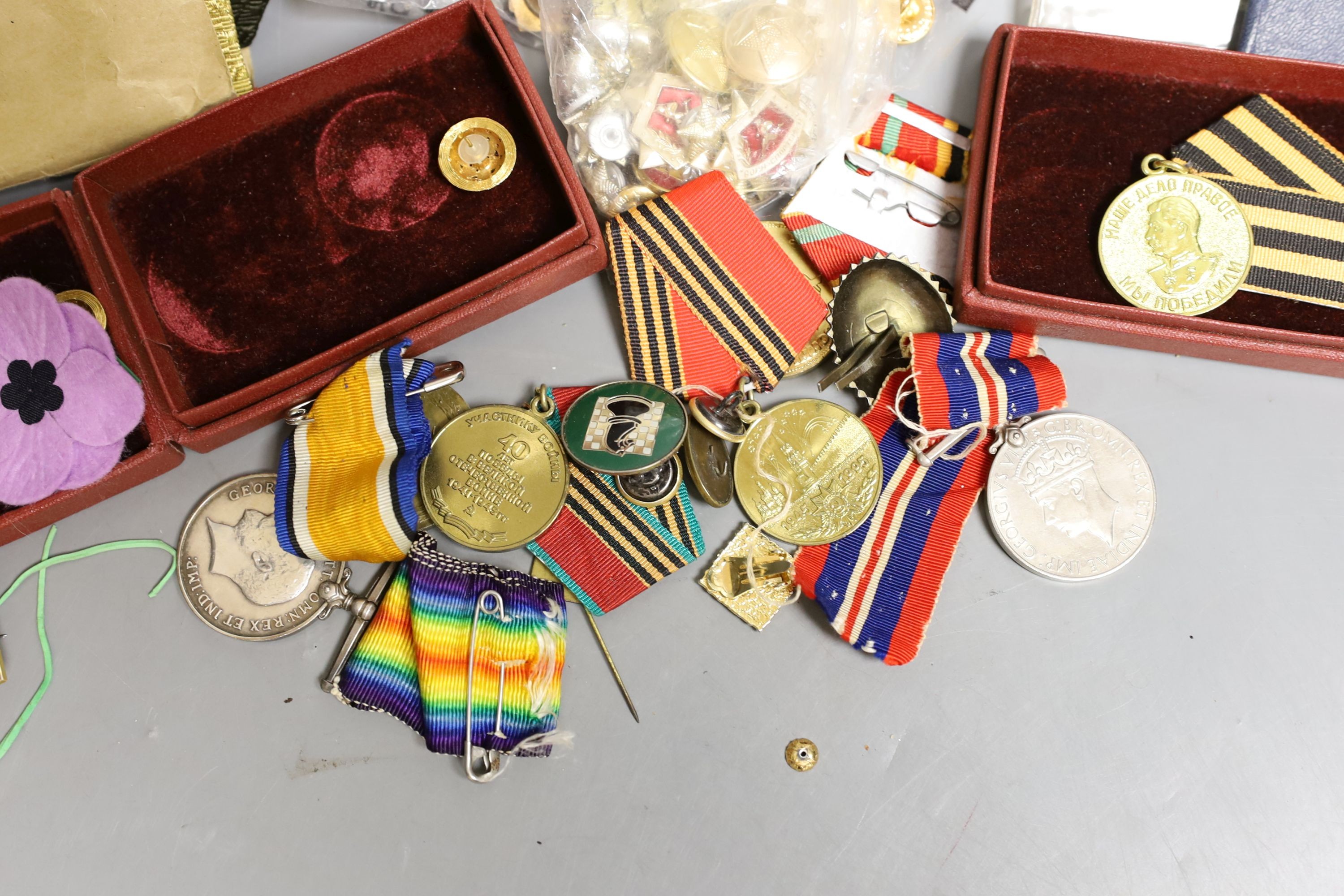 Three pairs of Polish Army shoulders pads, four U.S.S.R, Jubilee Medals, buttons, brooches and WWI medal group to Pte. G. Huggett, Royal Sussex Regiment, a WWII war medal and a USSR WWII 'Stalin' Medal.